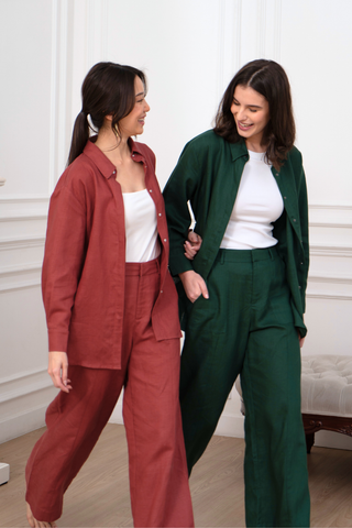 Two women wearing TENCEL Linen Shirts, Padded Bra Tank Tops and WIde-leg pants with an adjustable waistband.