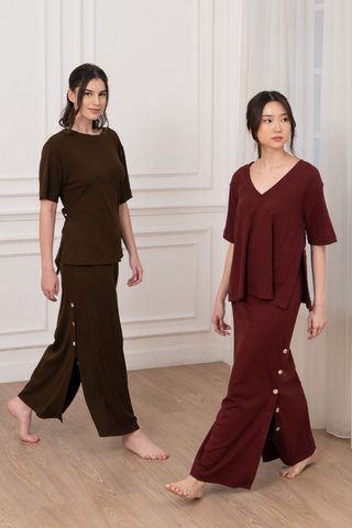 two models wearing tabitha multi-way tee and tabitha stretchy button skirt in olive and wine